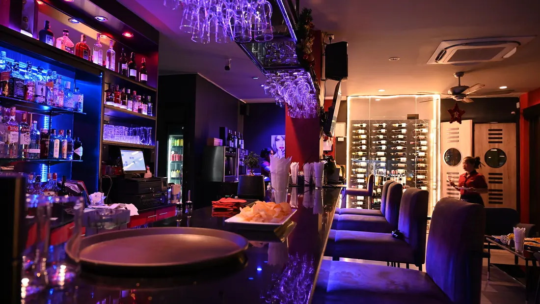 Glasses of wine and beer on a bar counter