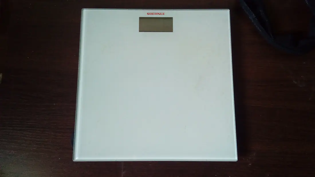 A bathroom scale on a floor