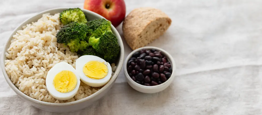 Photograph: plates of everyday food and fresh groceries on a kitchen counter
