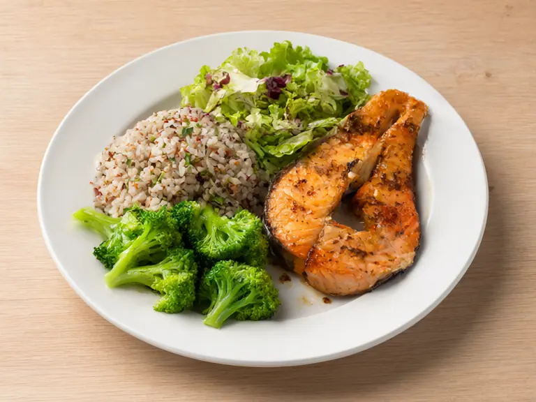 A plate of food with protein, starch and vegetables